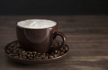 Fototapeta premium Foam Topped Coffee on a Wooden Table