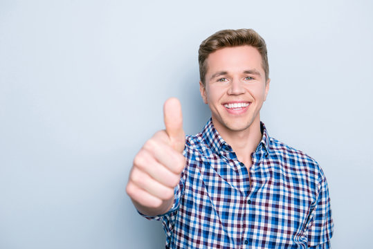 People entertainment delight person promo promotion concept. Close up portrait of excited cheerful joyful glad marketer making thumb-up symbol isolated on gray background casual trendy stylish outfit
