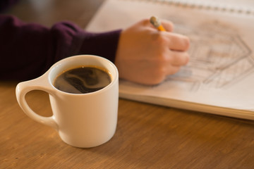 Coffee and Drawing in Coffee Shop