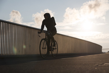 COPENHAGEN, DENMARK - SEPTEMBER 22 2017: Single Cyclist on bridge inderhavnsbroen on a sunny morning