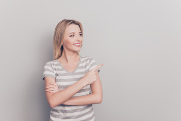 Sale discount feedback person people concept. Close up portrait of confident  friendly good-looking woman Pointing aside on empty blank place with forefinger over shoulder isolated on gray background