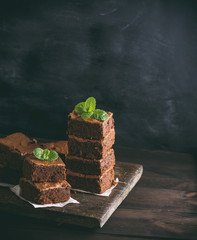 two stacks of square pieces of chocolate baked brownie pie