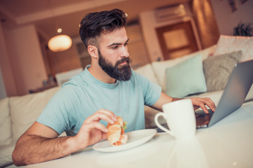 Man working on laptop from home