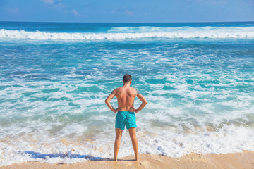 Man enjoying on a tropical ocean beach.