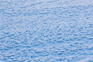 Snow ice crystal formation on ice surface