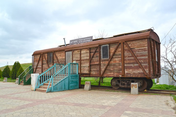 ELISTA, RUSSIA. Fragment of the memorial complex "Outcome and Return". Car museum of Stalin deportation of Kalmyks. The Russian text - the Museum of deportation