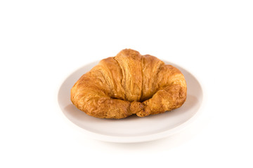 croissant on a plate on white background