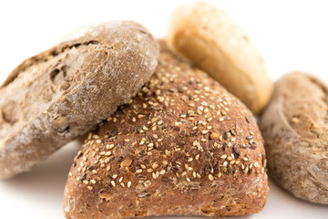 bread with cereals and nuts on white background