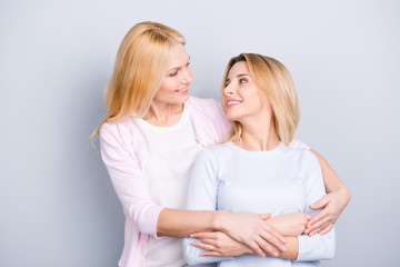 Lovely single grandma embracing adult charming attractive pretty child, family with one parent...