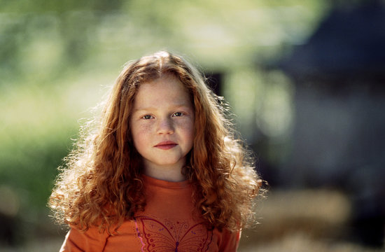 Portrait of little girl with red hair