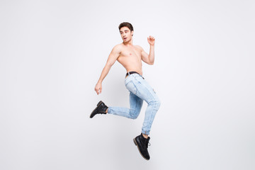 Fototapeta na wymiar Freedom athlete turn boots shoes vogue modern model advertising concept. Full-length full-size portrait of attractive powerful handsome guy jumping up isolated on gray background copy-space