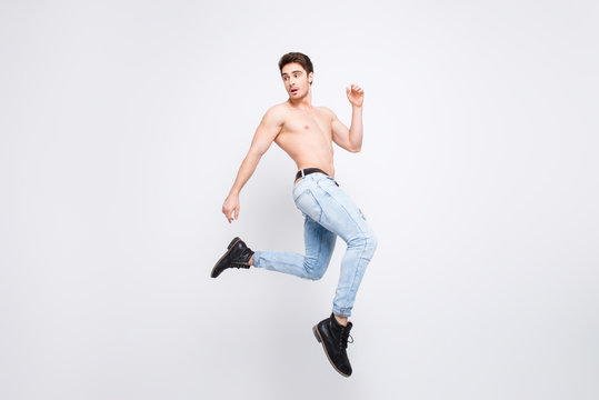 Freedom athlete turn boots shoes vogue modern model advertising concept. Full-length full-size portrait of attractive powerful handsome guy jumping up isolated on gray background copy-space
