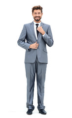 Man in suit straightens collar, portrait on white background
