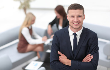 young businessman on blurred background office.