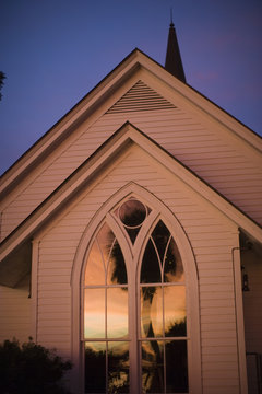 Sunset reflected in church windows