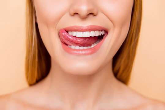 Closeup Cropped Half Face Shot Of Femenine Gorgeous Playful Charming Adorable Nude Natural Lady With White Healthy Teeth Gesturing Showing Tongue Out Isolated On Beige Background, Correction Concept