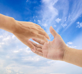 helping hands on sky background