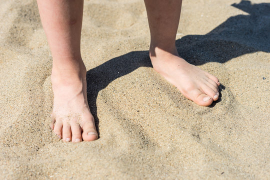 feet in the sand - summer time