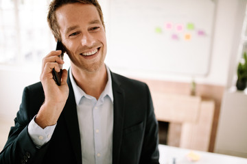 Businessman talking over mobile phone