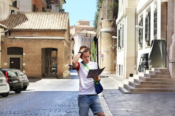 Fototapeta premium Tourist looking at map