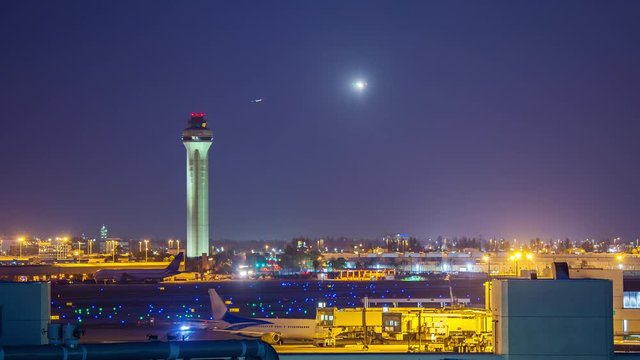 Air Traffic Night Generic Airport Timelapse with ATC Tower with Flying Commercial Jet Airliners in a Vibrant Blue Sky Approaching the Runway