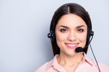 Portrait with copy space of cheerful positive cute woman in shirt with headset and microphone on...