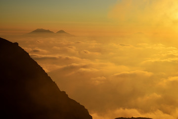 Spectacular sunset over the Aeolian Islands seen from the summit of Volcano Stromboli, Sicily, Italy