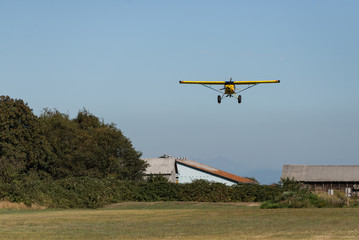 Fototapeta premium Airplane on Approach - Grass Field Landing