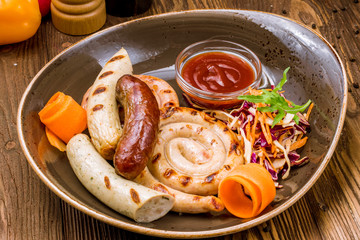 assorted sausages with sauces