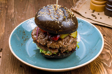 Fototapeta na wymiar Black Burger with meat
