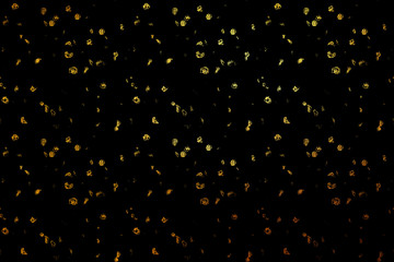 Glittering / shiny golden abstract on black background for print and design.