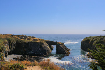 Fototapeta na wymiar Mendicino California Headlands View to beach from rock arch - selective focus