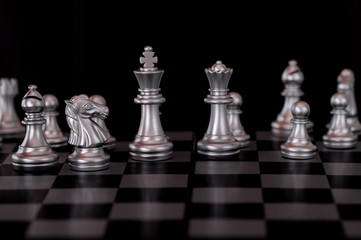 Silver Chess set on board background