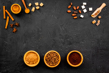 Seasoning for cooking desserts. Cinnamon, cocoa, badian on black background top view space for text
