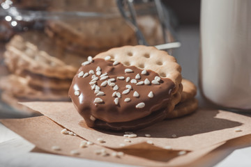 close-up shot of delicious cookies dipped in hot chocolate and sesame