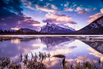 Sunrise at Vermilion lake, Banff National Park, Alberta, Canada. This photo was taken during the transition between winter and snow season. - obrazy, fototapety, plakaty
