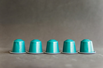 Beautiful colored coffee capsules on black background