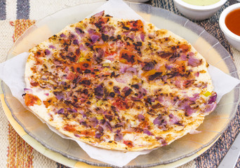 South Indian Food Uttapam Also Know As ooththappam, Rava Uttapam, Uttapa or Uthappa is a Popular South Indian Delicious Spicy Breakfast Snack Served with Coconut Chutney, Tomato Sauce and Sambar