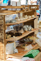 Counter with homemade cheeses at the street fair.