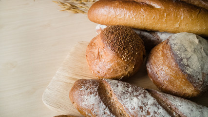 Bread  Wheat oats on wood  image background.