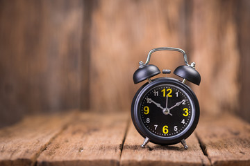 Alarm clock on wood
