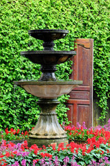 Round water fountain in the garden