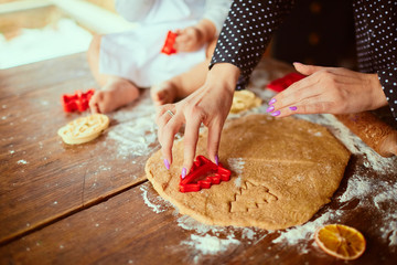 The mother with son baking cookies  in the kitchen