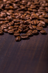 Coffee beans on old wooden table. Vintage style