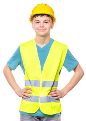 Emotional portrait of teen boy wearing safety jacket and hard hat. Happy child looking at camera, isolated on white background. Funny cute engineer, entrepreneur, construction worker or architect.