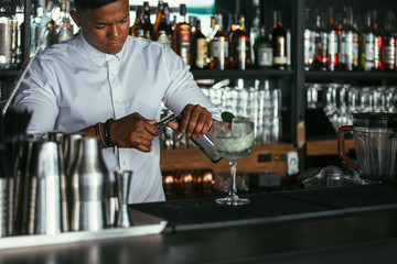 Bartender opening bottle
