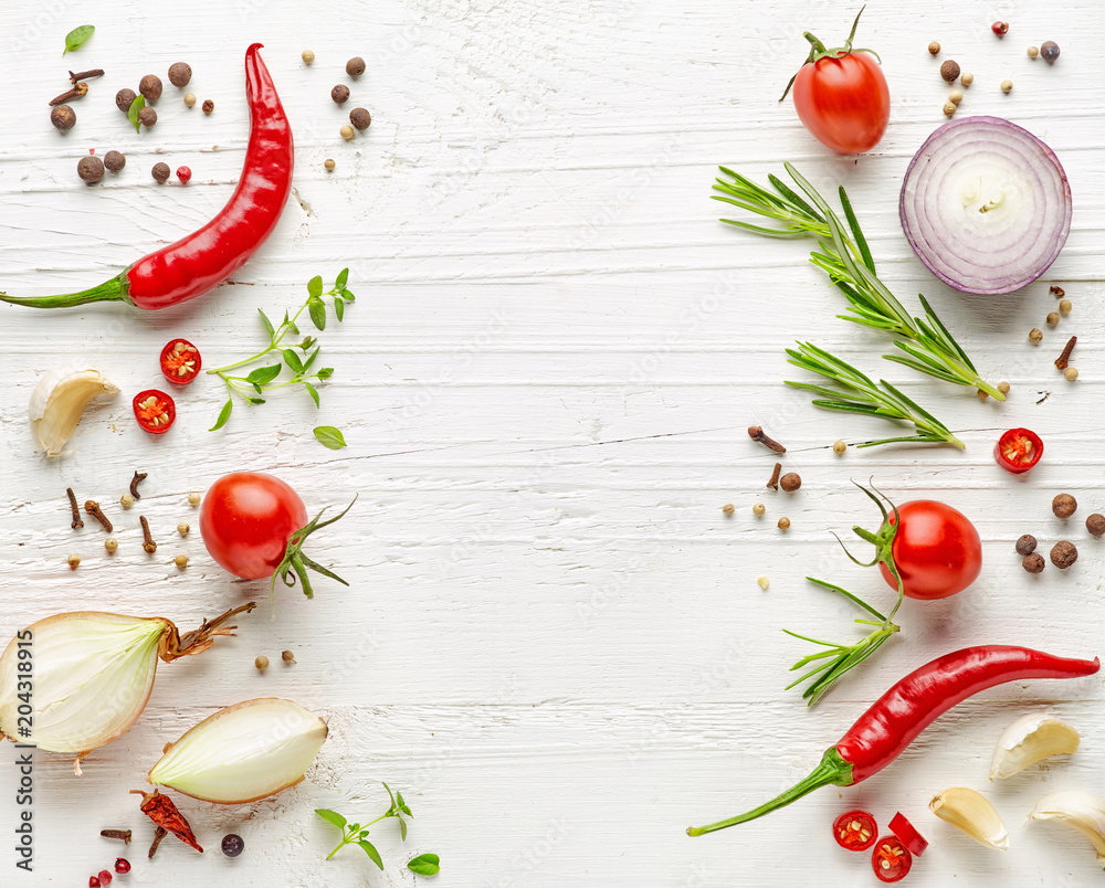 Wall mural various herbs and spices on white wooden table