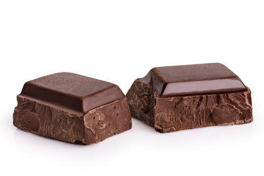 Pieces of dark chocolate isolated on white background.