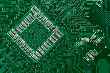 Ceramic Capacitors on Green Digital electronic circuit board texture pattern background
