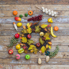 autumn wreath of leaves on a wooden wall